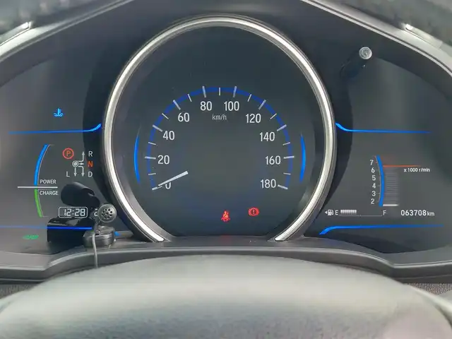 ホンダ フィット ハイブリット Lパッケージ 東京都 2015(平27)年 6.4万km ホワイトオーキッドパール あんしんパッケージ/・シティブレーキアクティブシステム/クルーズコントロール/プッシュスタート/純正ナビ/フルセグTV/バックカメラ/ETC/ハーフレザーシート/LEDヘッドライト/オートライト/ドアバイザー/スマートキー