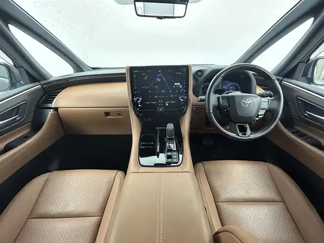 トヨタ ヴェルファイア ハイブリット Z プレミア 熊本県 2023(令5)年 2万km ブラック 禁煙車　/左右独立ムーンルーフ　/純正１４インチディスプレイオーディオ（BT・フルセグ・USB・HDMI）/全周囲カメラ　/純正12.1型フリップダウンモニター　/ミラー型ドライブレコーダー　/ビルトインETC2.0/100V充電/両側パワースライドドア　/前後クリアランスソナー/パワーバックドア/前席・2列目シートヒーター/前席・2列目エアーシート/前席パワーシート/オットマン/置くだけ充電/衝突軽減ブレーキ/レーンキープアシスト/ブラインドスポットモニター/横滑り防止/純正フロアマット/純正19インチAW/オートライト/オートマチックハイビーム/LEDヘッドライト/フォグランプ/スマートキー/プッシュスタート/スペアキー1本/保証書/取扱説明書