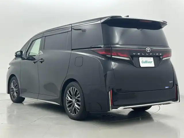 トヨタ ヴェルファイア ハイブリット Z プレミア 熊本県 2023(令5)年 2万km ブラック 禁煙車　/左右独立ムーンルーフ　/純正１４インチディスプレイオーディオ（BT・フルセグ・USB・HDMI）/全周囲カメラ　/純正12.1型フリップダウンモニター　/ミラー型ドライブレコーダー　/ビルトインETC2.0/100V充電/両側パワースライドドア　/前後クリアランスソナー/パワーバックドア/前席・2列目シートヒーター/前席・2列目エアーシート/前席パワーシート/オットマン/置くだけ充電/衝突軽減ブレーキ/レーンキープアシスト/ブラインドスポットモニター/横滑り防止/純正フロアマット/純正19インチAW/オートライト/オートマチックハイビーム/LEDヘッドライト/フォグランプ/スマートキー/プッシュスタート/スペアキー1本/保証書/取扱説明書
