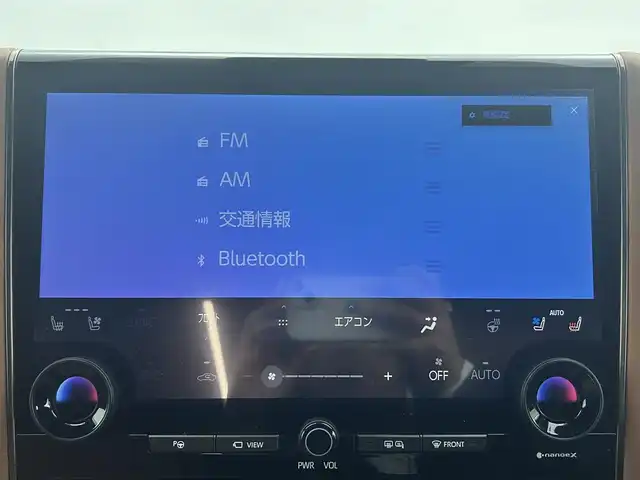 トヨタ ヴェルファイア ハイブリット Z プレミア 熊本県 2023(令5)年 2万km ブラック 禁煙車　/左右独立ムーンルーフ　/純正１４インチディスプレイオーディオ（BT・フルセグ・USB・HDMI）/全周囲カメラ　/純正12.1型フリップダウンモニター　/ミラー型ドライブレコーダー　/ビルトインETC2.0/100V充電/両側パワースライドドア　/前後クリアランスソナー/パワーバックドア/前席・2列目シートヒーター/前席・2列目エアーシート/前席パワーシート/オットマン/置くだけ充電/衝突軽減ブレーキ/レーンキープアシスト/ブラインドスポットモニター/横滑り防止/純正フロアマット/純正19インチAW/オートライト/オートマチックハイビーム/LEDヘッドライト/フォグランプ/スマートキー/プッシュスタート/スペアキー1本/保証書/取扱説明書