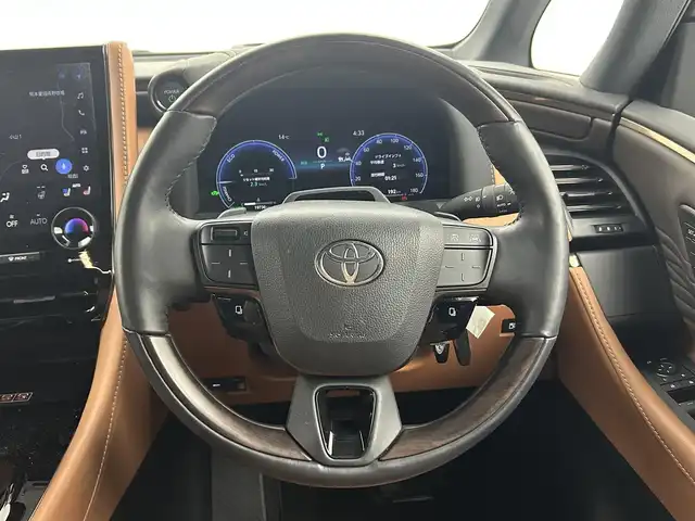 トヨタ ヴェルファイア ハイブリット Z プレミア 熊本県 2023(令5)年 2万km ブラック 禁煙車　/左右独立ムーンルーフ　/純正１４インチディスプレイオーディオ（BT・フルセグ・USB・HDMI）/全周囲カメラ　/純正12.1型フリップダウンモニター　/ミラー型ドライブレコーダー　/ビルトインETC2.0/100V充電/両側パワースライドドア　/前後クリアランスソナー/パワーバックドア/前席・2列目シートヒーター/前席・2列目エアーシート/前席パワーシート/オットマン/置くだけ充電/衝突軽減ブレーキ/レーンキープアシスト/ブラインドスポットモニター/横滑り防止/純正フロアマット/純正19インチAW/オートライト/オートマチックハイビーム/LEDヘッドライト/フォグランプ/スマートキー/プッシュスタート/スペアキー1本/保証書/取扱説明書