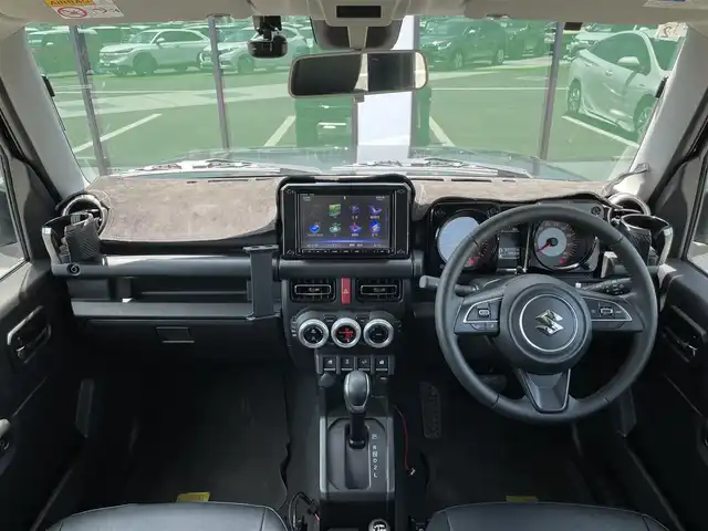 スズキ ジムニー シエラ JC 香川県 2020(令2)年 6.9万km ブルーイッシュブラックパール3 登録時走行距離：68303km/パナソニック製8型ナビ/　CD DVD BT フルセグTV/バックカメラ/ビルトインETC/ドライブレコーダー/衝突被害軽減装置/レーンキープアシスト/クルーズコントロール/ダウンヒルアシストコントロール/LEDヘッドライト/オートライト/フォグランプ/ヘッドライトウォッシャー/純正マッドガード/ルーフキャリア/背面タイヤ/電動格納ミラー/ヒーテッドドアミラー/純正革調シートカバー/シートヒーター/プッシュスタート/スマートキー/スペアキー