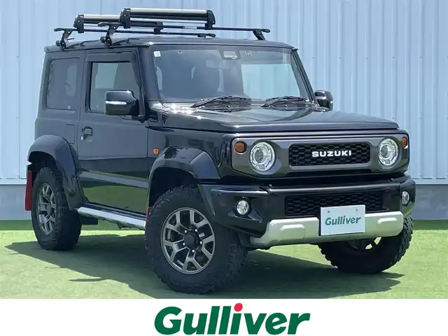 スズキ ジムニー シエラ JC 香川県 2020(令2)年 6.9万km ブルーイッシュブラックパール3 登録時走行距離：68303km/パナソニック製8型ナビ/　CD DVD BT フルセグTV/バックカメラ/ビルトインETC/ドライブレコーダー/衝突被害軽減装置/レーンキープアシスト/クルーズコントロール/ダウンヒルアシストコントロール/LEDヘッドライト/オートライト/フォグランプ/ヘッドライトウォッシャー/純正マッドガード/ルーフキャリア/背面タイヤ/電動格納ミラー/ヒーテッドドアミラー/純正革調シートカバー/シートヒーター/プッシュスタート/スマートキー/スペアキー
