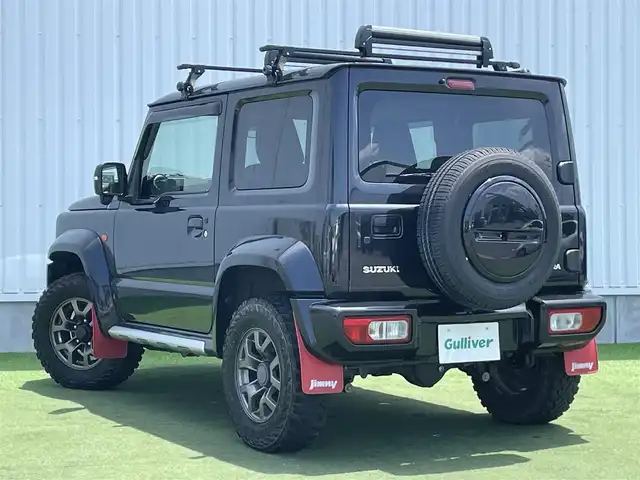 スズキ ジムニー シエラ JC 香川県 2020(令2)年 6.9万km ブルーイッシュブラックパール3 登録時走行距離：68303km/パナソニック製8型ナビ/　CD DVD BT フルセグTV/バックカメラ/ビルトインETC/ドライブレコーダー/衝突被害軽減装置/レーンキープアシスト/クルーズコントロール/ダウンヒルアシストコントロール/LEDヘッドライト/オートライト/フォグランプ/ヘッドライトウォッシャー/純正マッドガード/ルーフキャリア/背面タイヤ/電動格納ミラー/ヒーテッドドアミラー/純正革調シートカバー/シートヒーター/プッシュスタート/スマートキー/スペアキー