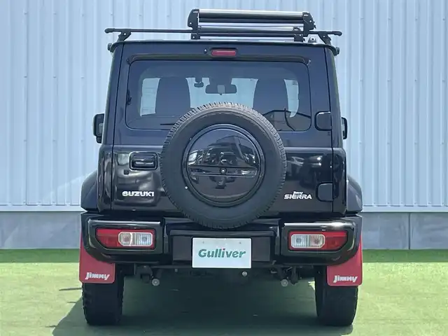 スズキ ジムニー シエラ JC 香川県 2020(令2)年 6.9万km ブルーイッシュブラックパール3 登録時走行距離：68303km/パナソニック製8型ナビ/　CD DVD BT フルセグTV/バックカメラ/ビルトインETC/ドライブレコーダー/衝突被害軽減装置/レーンキープアシスト/クルーズコントロール/ダウンヒルアシストコントロール/LEDヘッドライト/オートライト/フォグランプ/ヘッドライトウォッシャー/純正マッドガード/ルーフキャリア/背面タイヤ/電動格納ミラー/ヒーテッドドアミラー/純正革調シートカバー/シートヒーター/プッシュスタート/スマートキー/スペアキー