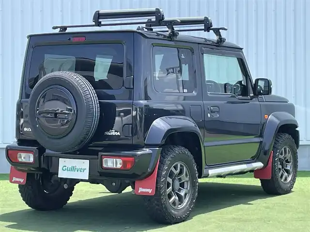 スズキ ジムニー シエラ JC 香川県 2020(令2)年 6.9万km ブルーイッシュブラックパール3 登録時走行距離：68303km/パナソニック製8型ナビ/　CD DVD BT フルセグTV/バックカメラ/ビルトインETC/ドライブレコーダー/衝突被害軽減装置/レーンキープアシスト/クルーズコントロール/ダウンヒルアシストコントロール/LEDヘッドライト/オートライト/フォグランプ/ヘッドライトウォッシャー/純正マッドガード/ルーフキャリア/背面タイヤ/電動格納ミラー/ヒーテッドドアミラー/純正革調シートカバー/シートヒーター/プッシュスタート/スマートキー/スペアキー