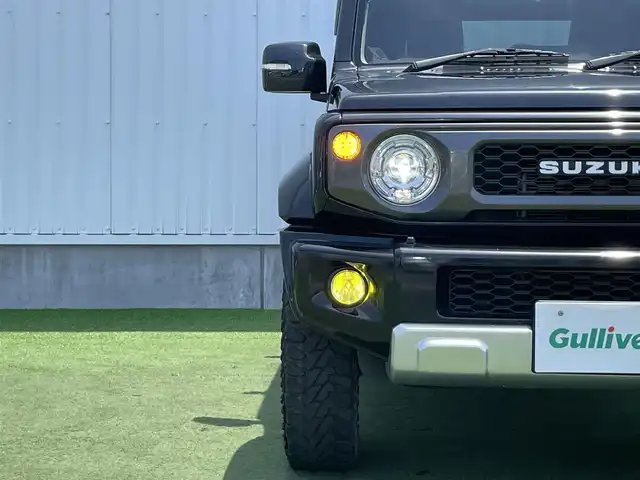 スズキ ジムニー シエラ JC 香川県 2020(令2)年 6.9万km ブルーイッシュブラックパール3 登録時走行距離：68303km/パナソニック製8型ナビ/　CD DVD BT フルセグTV/バックカメラ/ビルトインETC/ドライブレコーダー/衝突被害軽減装置/レーンキープアシスト/クルーズコントロール/ダウンヒルアシストコントロール/LEDヘッドライト/オートライト/フォグランプ/ヘッドライトウォッシャー/純正マッドガード/ルーフキャリア/背面タイヤ/電動格納ミラー/ヒーテッドドアミラー/純正革調シートカバー/シートヒーター/プッシュスタート/スマートキー/スペアキー