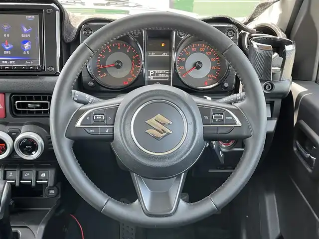 スズキ ジムニー シエラ JC 香川県 2020(令2)年 6.9万km ブルーイッシュブラックパール3 登録時走行距離：68303km/パナソニック製8型ナビ/　CD DVD BT フルセグTV/バックカメラ/ビルトインETC/ドライブレコーダー/衝突被害軽減装置/レーンキープアシスト/クルーズコントロール/ダウンヒルアシストコントロール/LEDヘッドライト/オートライト/フォグランプ/ヘッドライトウォッシャー/純正マッドガード/ルーフキャリア/背面タイヤ/電動格納ミラー/ヒーテッドドアミラー/純正革調シートカバー/シートヒーター/プッシュスタート/スマートキー/スペアキー