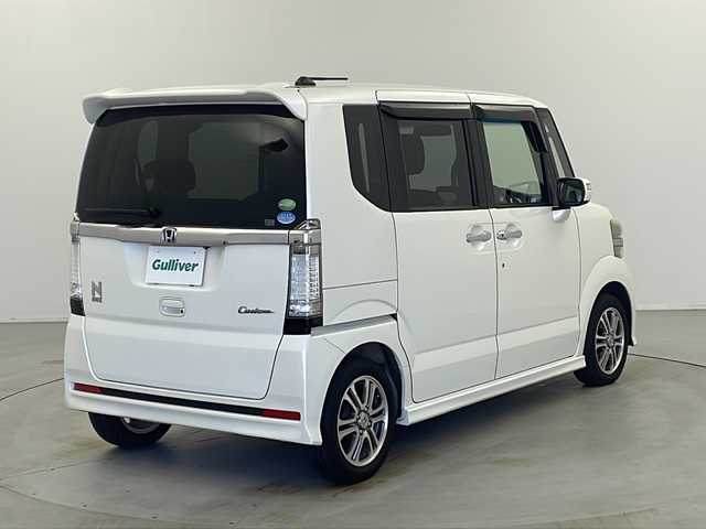 ホンダ Ｎ ＢＯＸ カスタム G Lパッケージ 栃木県 2013(平25)年 16.1万km プレミアムホワイトパール 社外SDナビ/・AM/FM/CD/DVD/フルセグ/SD/BT/iPod/左側電動スライドドア/ETC/HIDヘッドランプ/純正マット/ドアバイザー/社外14インチアルミ付きスタッドレス積み込み/保証書/取扱説明書