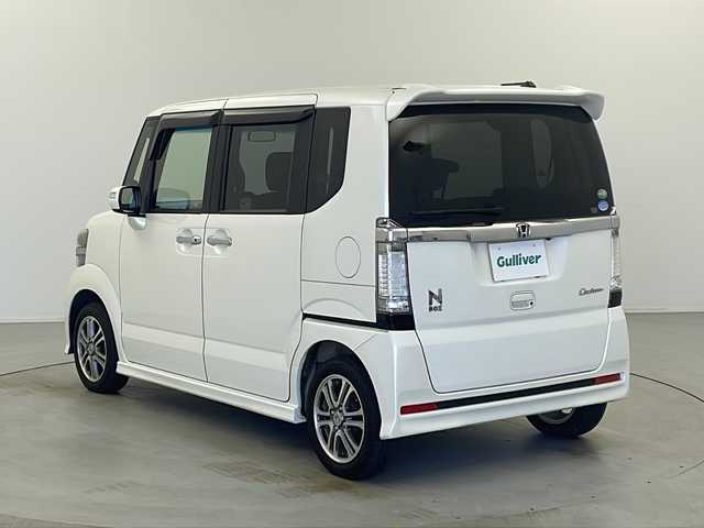 ホンダ Ｎ ＢＯＸ カスタム G Lパッケージ 栃木県 2013(平25)年 16.1万km プレミアムホワイトパール 社外SDナビ/・AM/FM/CD/DVD/フルセグ/SD/BT/iPod/左側電動スライドドア/ETC/HIDヘッドランプ/純正マット/ドアバイザー/社外14インチアルミ付きスタッドレス積み込み/保証書/取扱説明書