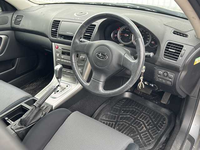 スバル レガシィ ツーリングワゴン 2．0i 愛媛県 2004(平16)年 11万km アーバングレーメタリック 純正オーディオ/ETC/４WD/フォグランプ/社外１６インチアルミホイール/純正フロアマット/リモコンキー/保証書/取扱説明書
