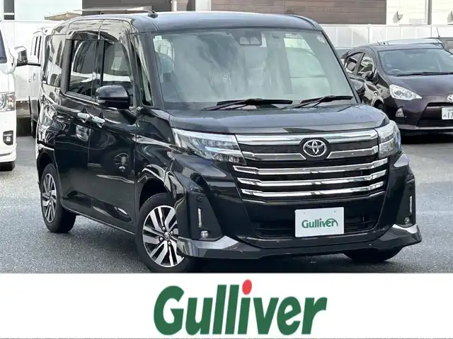 トヨタ ルーミー カスタムG 福岡県 2023(令5)年 1.2万km ブラックマイカメタリック 禁煙車/ワンオーナー/純正９型ディスプレイオーディオ（ＢＴ，フルセグＴＶ）/ビルトインＥＴＣ/前後ドラレコ/ＡＣＣ/コーナーセンサー/衝突軽減ブレーキ/両側電動スライドドア/クルーズコントロール/シートヒーター/社外１４インチＡＷ両側パワースライドドア/プッシュスタート/シートヒーター/シートバックテーブル/LEDヘッドライト/取扱説明書/保証書/スペアキー