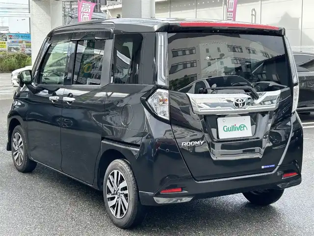 トヨタ ルーミー カスタムG 福岡県 2023(令5)年 1.2万km ブラックマイカメタリック 禁煙車/ワンオーナー/純正９型ディスプレイオーディオ（ＢＴ，フルセグＴＶ）/ビルトインＥＴＣ/前後ドラレコ/ＡＣＣ/コーナーセンサー/衝突軽減ブレーキ/両側電動スライドドア/クルーズコントロール/シートヒーター/社外１４インチＡＷ両側パワースライドドア/プッシュスタート/シートヒーター/シートバックテーブル/LEDヘッドライト/取扱説明書/保証書/スペアキー