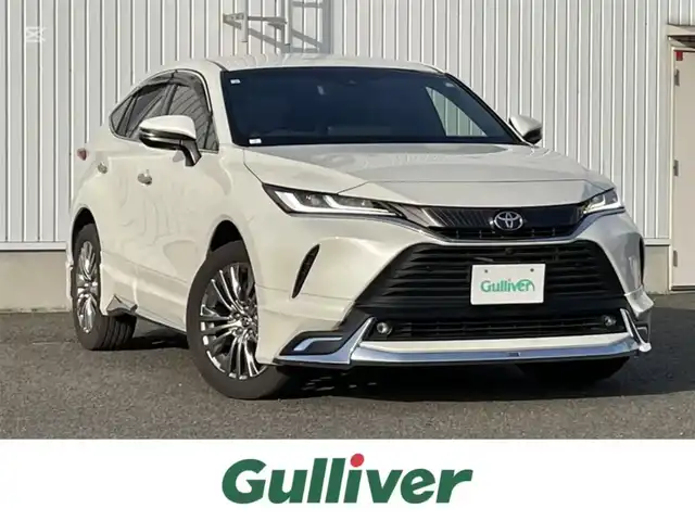 トヨタ ハリアー Z レザーパッケージ 熊本県 2020(令2)年 3.1万km ホワイトパールクリスタルシャイン モデリスタ/ＪＢＬディスプレイオーディオ/AM/FM/USB/BT/フルセグTV/全方位カメラ/トヨタセーフティセンス/・プリクラッシュセーフティ/・レーントレーシングアシスト/・ブラインドスポットモニター/・クリアランスソナー/・パーキングサポートブレーキ/・ロードサインアシスト/・オートマチックハイビーム/・レーダークルーズコントロール/ヘッドアップディスプレイ/革巻きステアリング/・ステアリングリモコン/・ステアリングヒーター/革シート/・D席メモリシート/・D/Nパワーシート/・D/Nシートヒーター/・D/Nシートクーラー/パワーバックドア/デジタルインナーミラー/ビルトインETC2.0/電動パーキング/オートホールド/スマートキー/プッシュスタート/純正フロアマット/ドアバイザー/純正アルミホイール