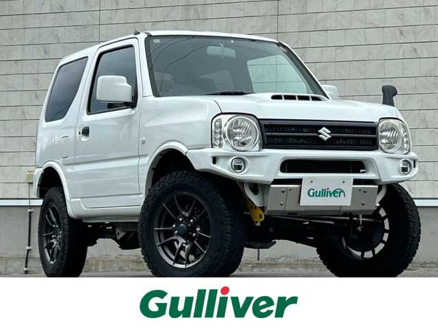 スズキ ジムニー XG 山形県 2014(平26)年 4.5万km スペリアホワイト ４WD/ターボ/フロントカメラ/横滑り防止装置/リフトアップ/社外足廻り/社外FRバンパー/社外マフラー/社外アルミホイール/背面タイヤ/フォグランプ/スペアキー/保証書
