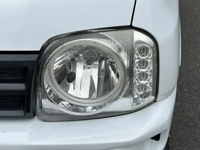 スズキ ジムニー XG 山形県 2014(平26)年 4.5万km スペリアホワイト ４WD/ターボ/フロントカメラ/横滑り防止装置/リフトアップ/社外足廻り/社外FRバンパー/社外マフラー/社外アルミホイール/背面タイヤ/フォグランプ/スペアキー/保証書