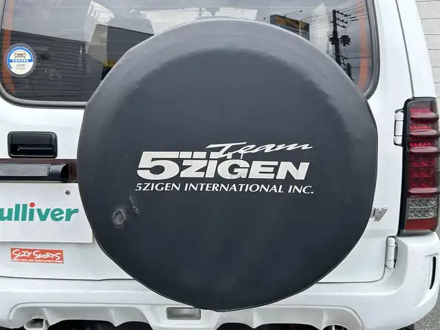 スズキ ジムニー XG 山形県 2014(平26)年 4.5万km スペリアホワイト ４WD/ターボ/フロントカメラ/横滑り防止装置/リフトアップ/社外足廻り/社外FRバンパー/社外マフラー/社外アルミホイール/背面タイヤ/フォグランプ/スペアキー/保証書