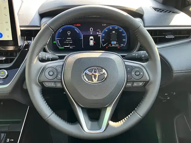 トヨタ カローラ クロス ハイブリッド Z 静岡県 2025(令7)年 0.1千km ブラックマイカ 登録済未使用車/純正10.5インチディスプレイオーディオ（BT/フルセグ）/ガラスルーフ/バックカメラ/電動リアゲート/前席シートヒーター/前席エアシート/純正ETC2.0/純正18インチアルミホイール/コーナーセンサー前後/レーンキープアシスト/オートライト/オートマチックハイビーム/LEDヘッドライト/W+サイドエアバック/衝突軽減システム/エンジンスタートボタン/パワーステアリング/パワーウィンドウ/アイドリングストップ/レーダークルーズコントロール/スマートキー/オートエアコン/USB入力端子/フロアマット/ハーフレザーシート/ルーフレール/ABS