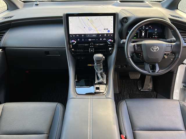 トヨタ アルファードハイブリット Z 広島県 2024(令6)年 1.5万km プラチナホワイトパールマイカ 禁煙/左右独立ムーンルーフ/セーフティセンス/・プリクラッシュセーフティ/・レーントレーシングアシスト/・レーダークルーズコントロール/・アダプティブハイビーム/・ロードサインアシスト/・ドライバー異常時対応/・プロアクティブドライビングアシスト/・発進遅れ告知機能/BSM/パーキングサポートブレーキ/純正14インチディスプレイ/ナビ/・FM/AM/Bluetooth/USB/フルセグ/・Miracast/MDMI/Applecarplay/androidauto/・ETC2.0/パノラミックビューモニター/フリップダウンモニター/HUD/両側パワースライドドア/パワーバックドア/シートヒーター/ベンチレーション/パワーシート/メモリーシート/ステアリングヒーター/ドライブレコーダー(TZ-D203MW)/おくだけ充電/フロアマット/AC100V1500W