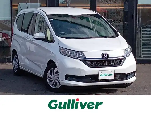 ホンダ フリード G ホンダセンシング 福井県 2021(令3)年 2.7万km プラチナホワイトパール 純正9インチナビ/AM/FM/フルセグ/BT/CD/DVD/USB/iPod/バックカメラ/両側パワースライドドア/アダプティブクルーズコントロール/レーンキープアシスト/横滑り防止装置/盗難防止装置/アイドリングストップ/ビルトインETC/前後ドライブレコーダー/純正フロアマット/ダブルエアバッグ/スマートキー/純正ホイルキャップ