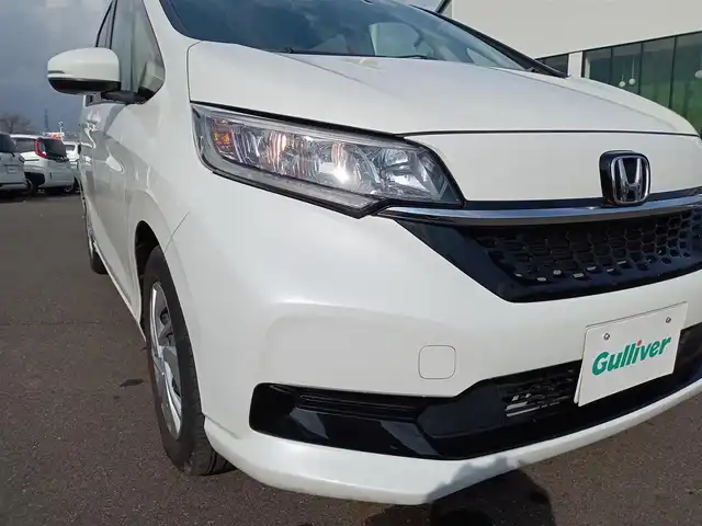 ホンダ フリード G ホンダセンシング 福井県 2021(令3)年 2.7万km プラチナホワイトパール 純正9インチナビ/AM/FM/フルセグ/BT/CD/DVD/USB/iPod/バックカメラ/両側パワースライドドア/アダプティブクルーズコントロール/レーンキープアシスト/横滑り防止装置/盗難防止装置/アイドリングストップ/ビルトインETC/前後ドライブレコーダー/純正フロアマット/ダブルエアバッグ/スマートキー/純正ホイルキャップ