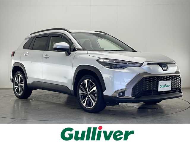トヨタ カローラ クロス ハイブリッド Z 宮崎県 2023(令5)年 2万km プラチナホワイトパールマイカ 禁煙車/トヨタセーフティセンス/純正10.5型ディスプレイオーディオ/（T-CONNECT/USB/HDMI/Bluetooth/FMAM）/純正ドライブレコーダー/純正LEDオートライト/純正LEDフォグ/純正18インチアルミ/純正フロアマット/全方位モニター/プリクラッシュセーフティ/アダプティブクルーズコントロール/レーンディパーチャーアラート/オートマチックハイビーム/ブラインドスポットモニター/電子パーキング/オートホールド/ハーフレザーシート/運転席パワーシート/前席シートヒーター/ウインカードアミラー/本革巻ハンドル/ETC/スマートキー/スペアキー1本/プッシュエンジンスタート/新車時保証書/取扱い説明書