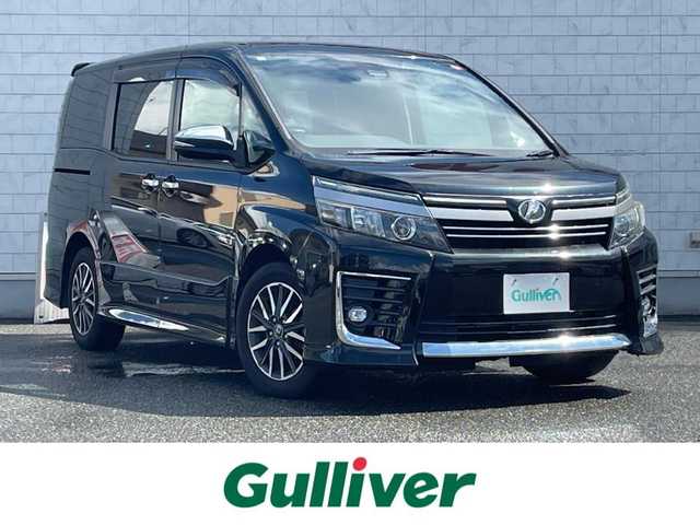 トヨタ ヴォクシー ZS 煌Ⅱ 山口県 2016(平28)年 7.9万km ブラック 9型ナビ フルセグTV CD DVD BT/フリップダウンモニター/両側パワースライドドア/衝突被害軽減ブレーキ/レーンアシスト/オートマチックハイビーム/LEDオートヘッドライト/フォグライト/スマートキー/リア窓ロールサンシェード/ステアリングリモコン/横滑り防止/禁煙車