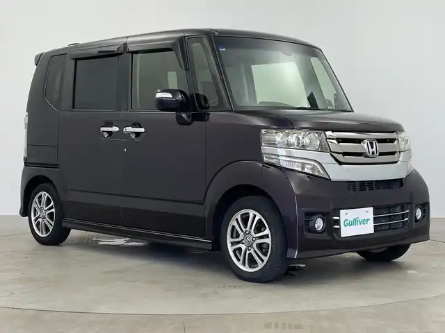 ホンダ Ｎ ＢＯＸ カスタム G SSパッケージ 鹿児島県 2015(平27)年 6.8万km プレミアムベルベットパープル・パール あんしんパッケージ/社外SDナビ/DVD再生可/ワンセグTV/両側電動スライドドア/ステアリングスイッチ/HIDヘッドライト/オートライトコントロール/リアサンシェード/純正14インチアルミホイール/スマートキー×2/エンジンプッシュスタート/純正フロアマット