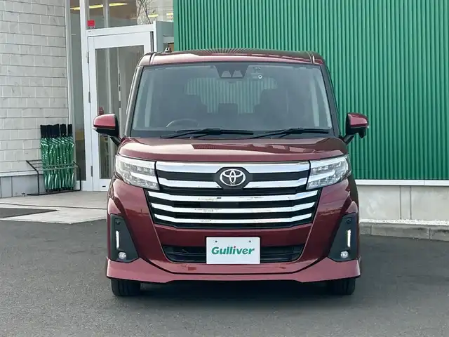 トヨタ ルーミー カスタムG－T 宮城県 2021(令3)年 1.5万km ファイアークォーツレッドM スマートアシスト/・衝突回避支援ブレーキ機能/・衝突警報機能/・車線逸脱警報機能/・ふらつき警報/・ブレーキ制御機能付誤発進抑制機能/・サイドビューランプ/・先行車発進お知らせ機能/・コーナーセンサー/・アダプティブドライビングビーム/・路側逸脱警報/・アダプティブクルーズコントロール/・標識認識機能/純正ナビ（NSZT-W68T）/・CD/DVD/・Bluetooth/・フルセグTV/バックカメラ/ビルトインETC/ドライブレコーダー/ウェルカムパワースライドドア（運転席側/助手席側）/革巻きステアリング/ステアリングスイッチ/電動パーキングブレーキ/ブレーキホールド/LEDヘッドランプ/フォグランプ/オートライト/スマートキー＆プッシュスタート/スペアキー1本/電動格納ミラー/純正15インチAW/フロアマット/ドアバイザー/Wエアバッグ