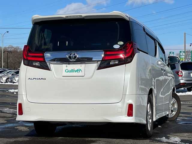 トヨタ アルファード S Aパッケージ 道央・札幌 2015(平27)年 7.5万km ホワイトパールクリスタルシャイン ４WD/純正SDナビ/純正フリップダウンモニター/横滑り防止装置/クルーズコントロール/クリアランスソナー/バックカメラ/ビルトインETC/アイドリングストップ/ECOMODE/両側パワースライドドア/N席/２列目オットマン/革巻きステアリング/ステアリングリモコン/AC100V/電動パーキング/ブレーキホールド/MTモード付AT/プッシュスタート/スマートキー/LEDヘッドライト/オートライト/フォグランプ/電動格納ミラー/ウィンカーミラー/ドアバイザー/スペアキー