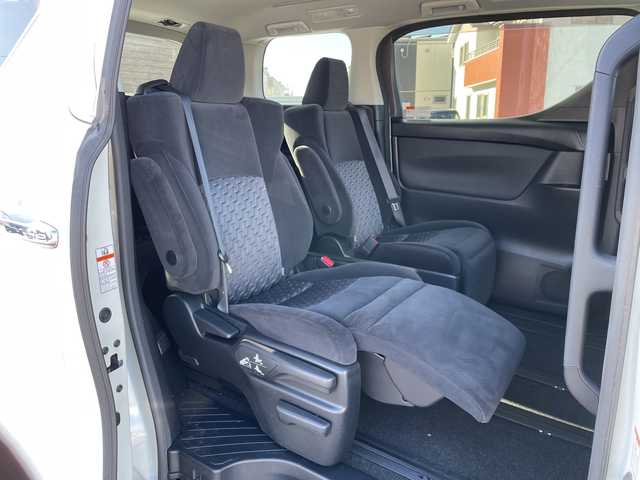 トヨタ アルファード S Aパッケージ 道央・札幌 2015(平27)年 7.5万km ホワイトパールクリスタルシャイン ４WD/純正SDナビ/純正フリップダウンモニター/横滑り防止装置/クルーズコントロール/クリアランスソナー/バックカメラ/ビルトインETC/アイドリングストップ/ECOMODE/両側パワースライドドア/N席/２列目オットマン/革巻きステアリング/ステアリングリモコン/AC100V/電動パーキング/ブレーキホールド/MTモード付AT/プッシュスタート/スマートキー/LEDヘッドライト/オートライト/フォグランプ/電動格納ミラー/ウィンカーミラー/ドアバイザー/スペアキー