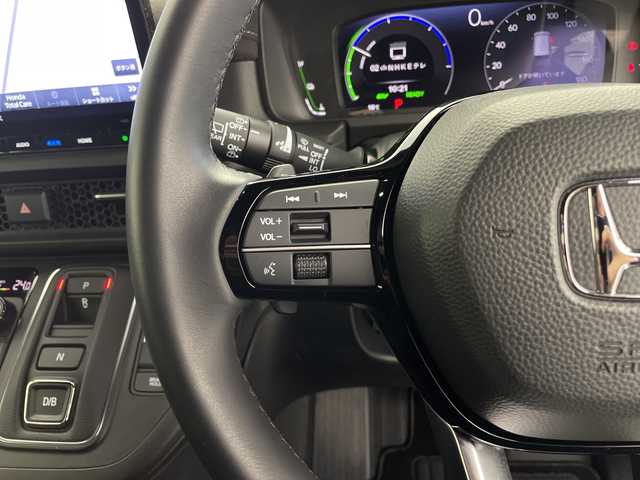 ホンダ ステップワゴン スパーダ eHEV プレミアムライン 鹿児島県 2023(令5)年 0.8万km プラチナホワイトパール 純正11インチナビ/（Bluetooth/フルセグTV/CD/DVD/USB接続）/純正フリップダウンモニター/マルチビューカメラ/パワーバックドア/パドルシフト/レーダークルーズコントロール/両側パワースライドドア/BSM/ハーフレザーシート/オットマン/オートライト/MUGENフロントグリル/ETC/前後ドライブレコーダー/純正フロアマット/純正17インチAW/スペアキー/AAC