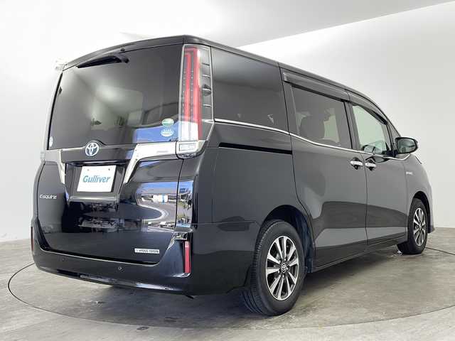 トヨタ エスクァイア ハイブリッド Gi プレミアムパッケージ ブラックテーラード 兵庫県 2019(令1)年 2万km ブラック ・純正9インチナビ＆TV＆BT＆CD＆DVD＆SD/・両側パワースライドドア/・ハーフレザーシート/・シートヒーター/・トヨタセーフティセンス/・プリクラッシュセーフティ/・レーンディパーチャーアラート/・オートマチックハイビーム/・クリアランスソナー/・クルーズコントロール/・先行車発進告知機能/・車両接近通報装置/・ステアリングヒーター/・LEDヘッドライト/・自動防眩ミラー/・前後ドライブレコーダー/・ビルトインETC/・ステアリングリモコン/・TRC/・スマートキー