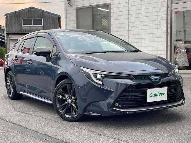 トヨタ カローラツーリング ハイブリッド ダブルバイビー 愛知県 2023(令5)年 3.4万km マッシブグレー ワンオーナー/バックカメラ/ETC2.0/純正メモリーナビ/Bluetooth/フルセグTV/追従クルーズコントロール/前後コーナーセンサー/シートヒーターD＋N席/ハンドルヒーター/純正フロアマット/純正アルミホイール/ABS/レーンキープアシスト/オートライト/オートマチックハイビーム/衝突被害軽減システム/カーテンエアバック/スマートキー/保証書/取扱説明書
