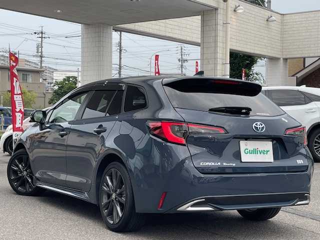 トヨタ カローラツーリング ハイブリッド ダブルバイビー 愛知県 2023(令5)年 3.4万km マッシブグレー ワンオーナー/バックカメラ/ETC2.0/純正メモリーナビ/Bluetooth/フルセグTV/追従クルーズコントロール/前後コーナーセンサー/シートヒーターD＋N席/ハンドルヒーター/純正フロアマット/純正アルミホイール/ABS/レーンキープアシスト/オートライト/オートマチックハイビーム/衝突被害軽減システム/カーテンエアバック/スマートキー/保証書/取扱説明書