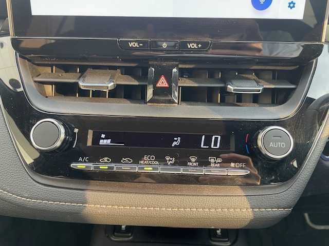 トヨタ カローラツーリング ハイブリッド ダブルバイビー 愛知県 2023(令5)年 3.4万km マッシブグレー ワンオーナー/バックカメラ/ETC2.0/純正メモリーナビ/Bluetooth/フルセグTV/追従クルーズコントロール/前後コーナーセンサー/シートヒーターD＋N席/ハンドルヒーター/純正フロアマット/純正アルミホイール/ABS/レーンキープアシスト/オートライト/オートマチックハイビーム/衝突被害軽減システム/カーテンエアバック/スマートキー/保証書/取扱説明書