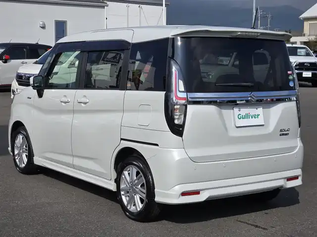 スズキ ソリオ HV MZ 鹿児島県 2021(令3)年 4万km ピュアホワイトP アダプティブクルーズコントロール　/純正オプション１０インチＳＤナビ　/全方位モニター　/Ｂｌｕｅｔｏｏｔｈオーディオ　/フルセグテレビ/カラーヘッドアップディスプレイ　/Ｄ＋Ｎ席シートヒーター　/スズキセーフティサポート/両側パワースライドドア/前後純正ドライブレコーダー/前後コーナーセンサー/横滑り防止装置/レーンキープアシスト/純正アルミホイール(15インチ)/プッシュスタート/スマートキー/エアバッグ(W+サイド)