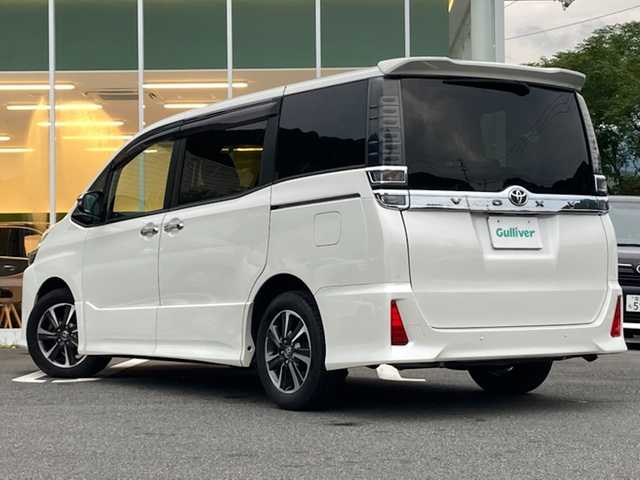 トヨタ ヴォクシー ZS 煌Ⅱ 愛媛県 2020(令2)年 5.1万km ホワイトパールクリスタルシャイン ワンオーナー/純正ナビ(NSZT-W68T)/・CD/DVD/フルセグTV/Bluetooth/SD/フリップダウンモニター/両側パワースライドドア /ドライブレコーダー前後/クルーズコントロール/衝突軽減ブレーキ/レーンキープアシスト/クリアランスソナー /LEDオートライト/・オートハイビーム /アイドリングストップ/ISOFIX/プッシュスタート