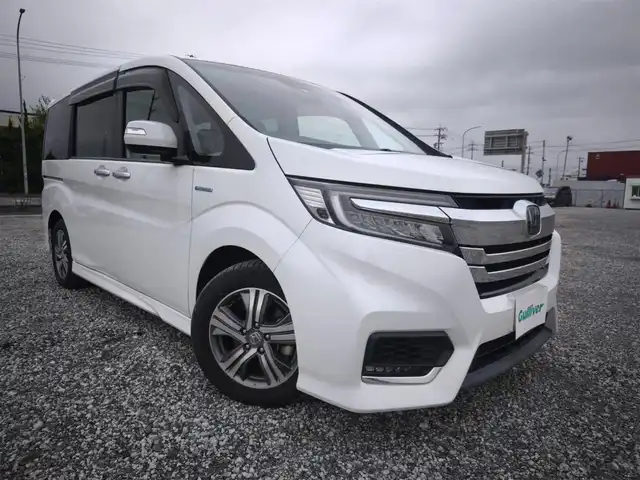 ホンダ ステップワゴン スパーダ ハイブリッド G EX ホンダセンシング 富山県 2018(平30)年 3.9万km プラチナホワイトパール 〇純正ナビ/〇フルセグTV/〇両側パワースライドドア/〇バックカメラ/〇ビルトインETC/〇アダプティプクルーズコントロール/〇ホンダセンシング/〇SRSエアバッグ/〇LEDヘッドランプ/〇LEDフロントフォグランプ/〇革巻きステアリングホイール/〇ソフトウィーブ/合皮コンビシート/〇シートヒーター/シートバックテーブル/〇ロールサンシェード/〇充電用USB端子/〇純正16インチアルミホイール/〇スマートキーシステム/〇禁煙車