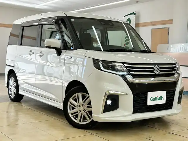 スズキ ソリオ HV MZ 道央・札幌 2023(令5)年 7.9万km ピュアホワイトP ・ワンオーナー/・衝突軽減ブレーキ/・横滑り防止装置/・車線逸脱警報/・アイドリングストップ/・ヘッドアップディスプレイ/・レーダークルーズコントロール/・両側パワースライドドア/・前席シートヒーター/・ミラーヒーター/・ＥＴＣ/・純正15インチＡＷ/・プッシュスタート/・スマートキー/オーディオレス車両