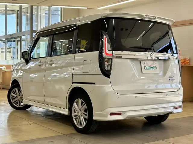 スズキ ソリオ HV MZ 道央・札幌 2023(令5)年 7.9万km ピュアホワイトP ・ワンオーナー/・衝突軽減ブレーキ/・横滑り防止装置/・車線逸脱警報/・アイドリングストップ/・ヘッドアップディスプレイ/・レーダークルーズコントロール/・両側パワースライドドア/・前席シートヒーター/・ミラーヒーター/・ＥＴＣ/・純正15インチＡＷ/・プッシュスタート/・スマートキー/オーディオレス車両