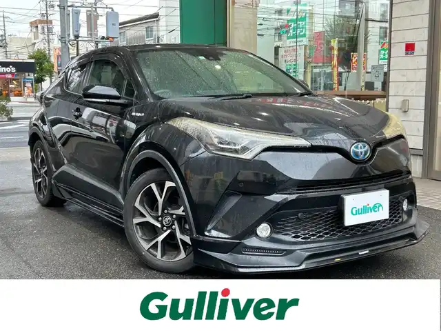 トヨタ Ｃ－ＨＲ G 愛知県 2017(平29)年 2.7万km ブラックマイカ TRD Aggressive Styleエアロ/・フロントスポイラー〈LED付〉/・サイドスカート/・リアアンダーエアロ/LEDヘッドライト〈MOP〉/・CHRロゴ入LEDヘッドライト/・シーケンシャルターンランプ/・LED式リアコンビネーションランプ/Carrozzeria製SDナビ〈AVIC-RW801〉/・DVD／Bluetooth／地デジTV/バックカメラ/ハーフレザーシート/前席シートヒーター/運転席オートリクライニング/TOYOTA SAFETY SENSE P/・プリクラッシュセーフティ/・レーンディパーチャーアラート/・オートマチックハイビーム/・レーダークルーズコントロール/ブラインドスポットモニター/クリアランスソナー/純正18インチAW/〈応急用スペアタイヤ有〉/スマートキー＆プッシュスタート