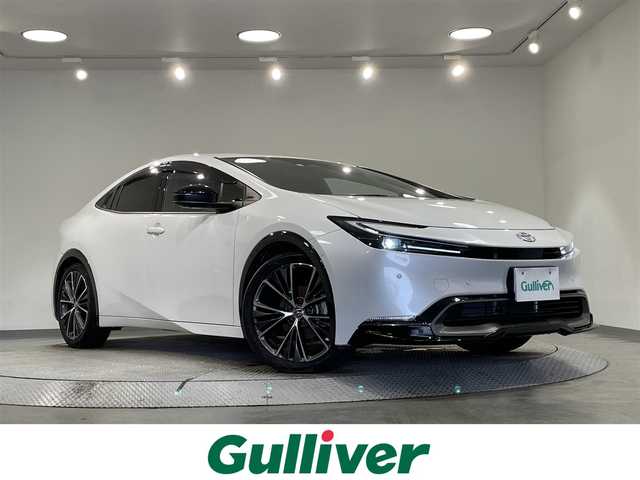 トヨタ プリウス Z 愛知県 2023(令5)年 2.3万km プラチナホワイトパールマイカ 純正１２．３インチディスプレイオーディオ/ＧＲフロントスポイラー/パノラミックビューモニター/衝突軽減ブレーキ/レーダークルーズコントロール/クリアランスソナー/ブラインドスポットモニター/レーンディパーチャーアラート/パワーバックドア/デジタルインナーミラー/ＥＴＣ２．０/置くだけ充電/シートヒーター/エアシート/パワーシート/シートメモリー/ハンドルヒーター/電動パーキング/AC100V【1500W】