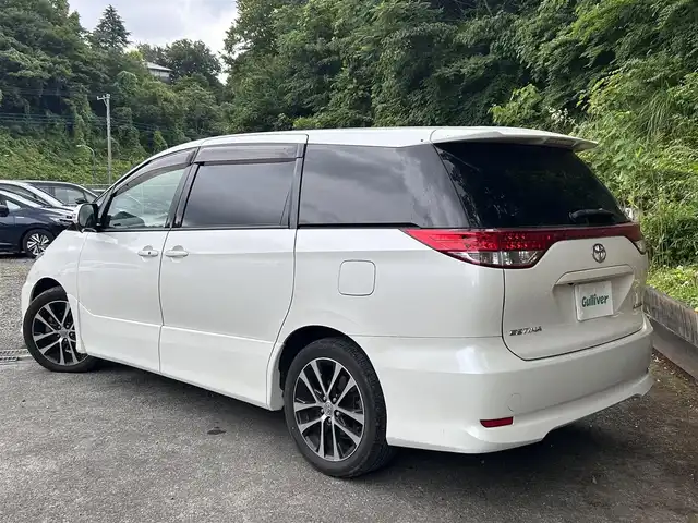 トヨタ エスティマ アエラス 島根県 2013(平25)年 7.7万km ホワイトパールクリスタルシャイン ALPINE9インチナビ/ALPINEフリップダウンモニター/フルセグTV/Bluetooth/クルーズコントロール/バックカメラ/両側パワースライドドア/純正フロアマット/純正18インチアルミホイール/MTモード付AT/オートライト/LEDヘッドライト