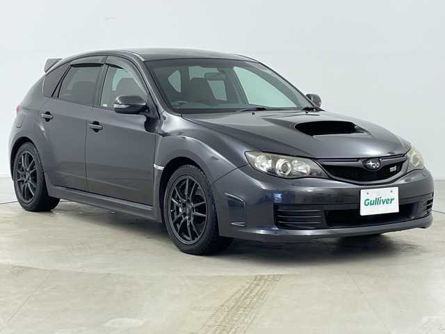 スバル インプレッサ ＷＲＸ STi 道央・札幌 2007(平19)年 13.7万km ダークグレーメタリック ・4WD/・純正エアロ（リア、サイドスポイラー）/・社外マフラー（ノーマル無）/・社外ナビ/・BT&CD/・横滑り防止装置/・SI-DRIVE/・ドライバーズコントロールセンターデフ/・クリフォードセキュリティ/・STI専用ハーフレザーシート/・ETC/・キセノンライト/・プッシュスタート/・スマートキー/・スペアリモコンキー×1/・セキュリティリモコン×1/・保証書/・取扱説明書