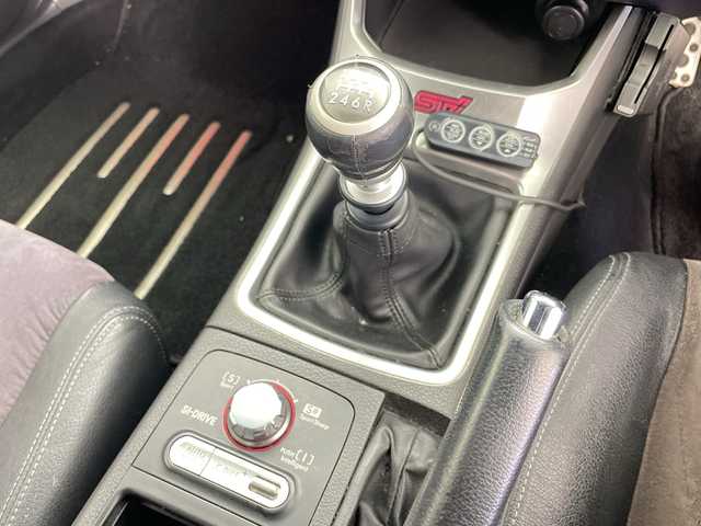 スバル インプレッサ ＷＲＸ STi 道央・札幌 2007(平19)年 13.7万km ダークグレーメタリック ・4WD/・純正エアロ（リア、サイドスポイラー）/・社外マフラー（ノーマル無）/・社外ナビ/・BT&CD/・横滑り防止装置/・SI-DRIVE/・ドライバーズコントロールセンターデフ/・クリフォードセキュリティ/・STI専用ハーフレザーシート/・ETC/・キセノンライト/・プッシュスタート/・スマートキー/・スペアリモコンキー×1/・セキュリティリモコン×1/・保証書/・取扱説明書