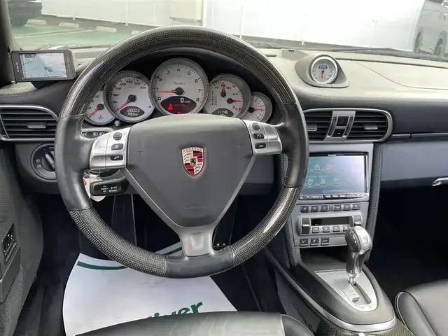 ポルシェ ９１１ ターボ 和歌山県 2007(平19)年 2.8万km 黒 ターボ/スポーツクロノパッケージ/カーボンインテリアトリム/Panasonicナビ/（フルセグTV/HDDMUSIC/CD/DVD/AM/FM/SD-Audio/VTR）/carrozzeria ウーファー/可動式リアウィング/純正20インチAW/スーパーキャットレーダー/記録簿（H19.H21.H22.H24.H25.H26.H28.H30.H31.R2.R4.R6)/純正フロアマット/シートヒーター　D/N/レザーシート/スペアキー×１/保証書/取扱説明書