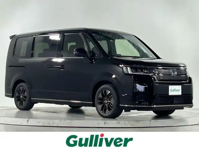 ホンダ ステップワゴン スパーダ eHEV 佐賀県 2025(令7)年 0.1千km クリスタルブラックパール 登録済未使用車/純正11.4インチナビ/CD/DVD/Bluetooth/バックカメラ/オットマン/パワーテールゲート/ハーフレザーシート/シートヒーター/ホンダセンシング/CMBS/パーキングセンサー/踏み間違い抑制装置/ブラインドスポットインフォメーション/レーンキープ/オートクルーズ/パドルシフト/スマートキー/スペアキー/保証書/取扱説明書/純正18インチアルミホイール