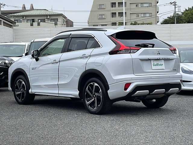 三菱 エクリプス クロス ＰＨＥＶ P 東京都 2022(令4)年 1.7万km ホワイトダイヤモンド ワンオーナー/新車時保証書　整備記録簿　/ナビ取説　取扱説明書/衝突被害軽減ブレーキ/車線逸脱警報/レーダークルーズコントロール/後側方車両検知警報/誤発進制御機能【前後】/純正ナビ/フルセグTV/BT/USB(オーディオ・ビデオ)//Apple CarPlay Android Auto/三菱パワーサウンドシステム/HUD/マルチアランドモニター　ETC2/0/LEDヘッドライト/オートライト/スマートキー×2/コーナーセンサー/ヒーター機能付き革巻きハンドル/レザーシート/全席シートヒーター/D/N席パワーシート/AC100V1500W/純正18インチアルミ