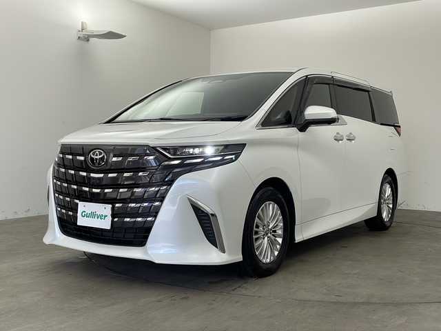 トヨタ アルファードハイブリット X 兵庫県 2025(令7)年 0.5万km プラチナホワイトパールマイカ ・トヨタセーフティーセンス/・プリクラッシュセーフティ/・レーダークルーズコントロール/・レーンディバチャーアラート/・ロードサインアシスト/・リヤクロストラフィックアラート/・後方車両接近告知/・プロアクティブドライビングアシスト/・パーキングサポートブレーキ/・安心降車アシスト/・周辺車両接近時サポート/・クリアランスソナー/・ブラインドスポットモニター/・純正9.8型ディスプレイオーディオ＆フルセグ＆BT＆USB/・パノラマミックビューモニター/・純正前後ドライブレコーダー/・デジタルインナーミラー/・横滑り防止装置/・電動パーキングブレーキ/・AC100V電源/・オートマチックハイビーム/・LEDヘッドライト/・フォグ/・オートライト/・後席サンシェード/・スマートキー/・スペアキー/・プッシュスタート/・W＋サイドエアバック/・カーテンエアバック